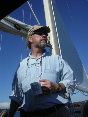 Tom Kelly aboard his sailboat Cygnet. 