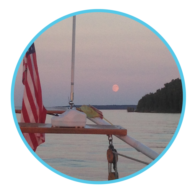 Moon in the distance with the stern of ship in foreground to showcase views during this specialty sail