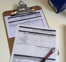 data sheets on clipboard