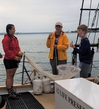 Curious kids holding sample net